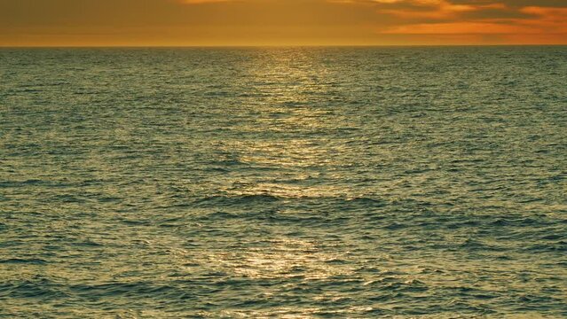 Never Endless Sea Water Surface View And Sun Blaze. Texture Of Water Surface Of Sea Reflection Of Suns Rays. Real time.
