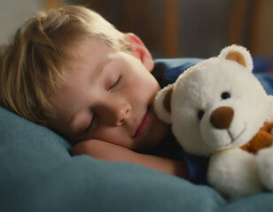 cute boy lying next to teddy bear sleeping