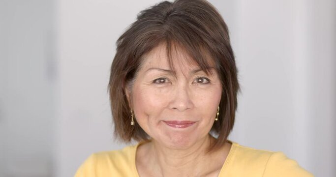 Closeup attractive woman smiling looking at camera enjoying making funny face gestures wink and smirk happy concept. 