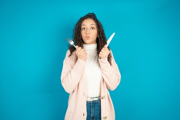 hungry beautiful teen girl wearing brown cardigan holding in hand fork knife want tasty yummy pizza pie