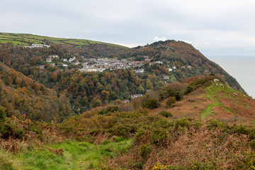 Fototapeta premium View from Countisbury Hill of the autumn colours at Lynton and Lynmouth in Devon
