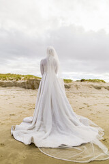 Fototapeta na wymiar Afghani bride's white wedding dress