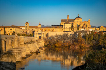 Fototapeta na wymiar View of the Roman bridge over the Guadalquivir river and the mosque and cathedral of Cordoba, Andalusia, Spain in the background