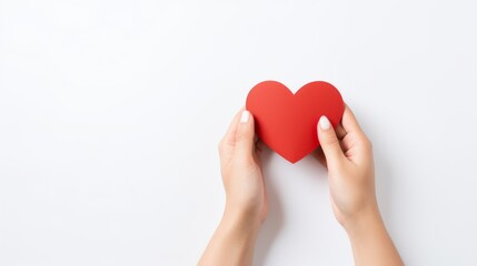 Fototapeta premium Love in the Palm: A Tender Gesture of Affection Captured in a Delicate Paper Heart on a Serene White Background