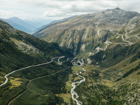 A view of roads, railways, rivers, and hiking trails through the valley and mountains in the Swiss Alps near Oberwald and Gletsch, Switzerland