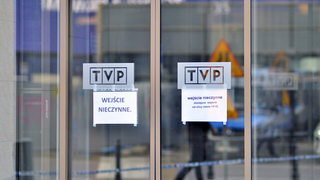 Warsaw, Poland. 29 December 2023. A sign on the door informing about closed doors.The logo of TVP (Polish Public Television) on entrance door.