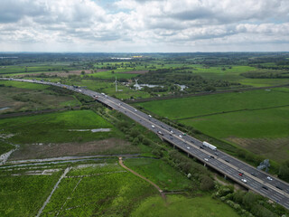 British Motorway through Farmland with Wind Turbines