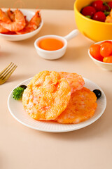 Shrimp steaks, snack made with shrimps and vegetables, children's food fried, golden and pink meat texture, closeup on tabletop indoors