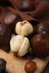 Many fresh salak fruits on table, closeup