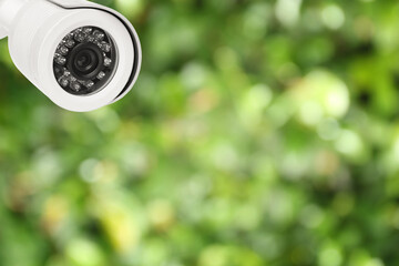 Modern security CCTV camera outdoors, space for text