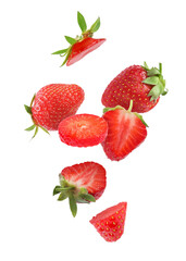 Fresh ripe strawberries falling on white background