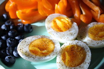 Eggs with blueberries and peppers