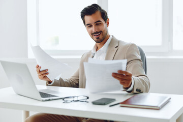 Office document suit company businessman paper happy laptop planning holding working job