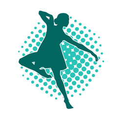 Silhouette of a female ballet dancer in action pose.