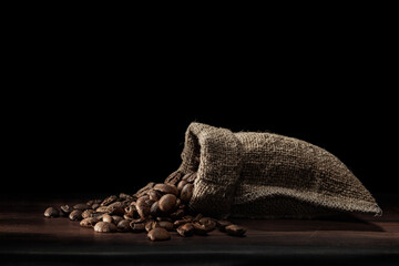 Coffee Beans Poured From Jute Bag.
