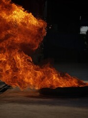Abstract shapeless fire, large burning fire, simulation of large ignition in oil steel tray, used...