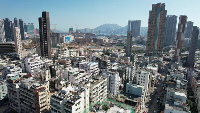 Drone Aerial Skyview in Kowloon City San Po Kong, a busy street with crowded people and an old densely residential and commercial downtown district located in Hong Kong, between Kai Tak To Kwa Wa