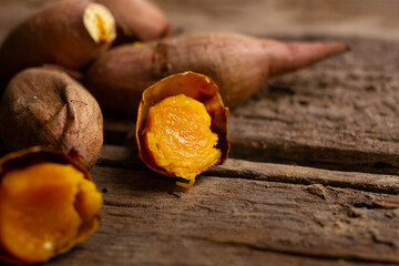 Very creamy of Baked Japanese sweet potato on wooden table.