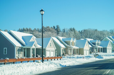 houses in residential community after snow in winter  - obrazy, fototapety, plakaty