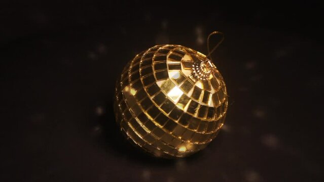 Retro golden disco ball rotating 