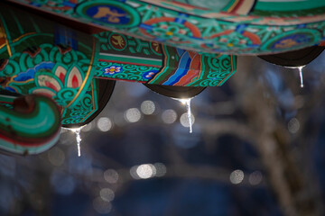 Roof of traditional Korean houses with icicles, Korean ancient architecture with icicles, snow,...
