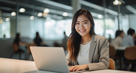 diligent young woman works seamlessly in her office, dedicated to her tasks and engaged with her laptop. Generative AI.