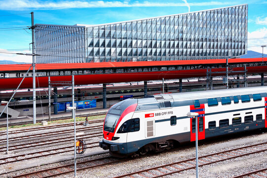 Geneva, Switzerland, Europe - Stadler KISS Swiss - Electric multiple unit train at Geneve-Secheron railway station, in background  JTI Building - headquarters of Japan Tobacco International 