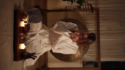 Chinese tea ceremony is performed by female master. Woman putting tea leaves in the teapot - Powered by Adobe