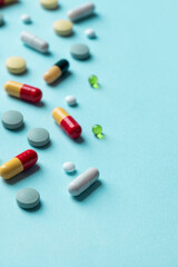 Different pills on color background, flat lay