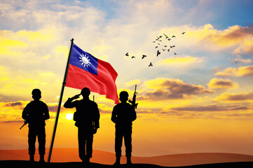 Silhouettes of soldiers with the Taiwan flag stand against the background of a sunset or sunrise. Concept of national holidays. Commemoration Day.