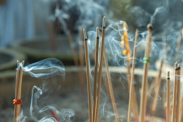 People who believe and admire Buddhism light incense sticks and worship the Buddha image.