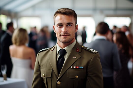 Handsome young man in military uniform standing in front of crowd