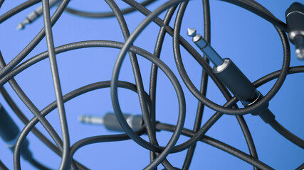 Abstract background with tangled audio cables with jacks. 3D illustration
