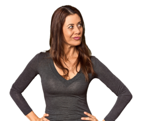 Elegant middle-aged Caucasian woman in studio setting confused, feels doubtful and unsure.