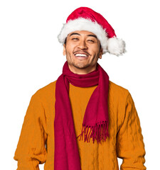 Joyful Chinese man with Christmas attire celebrating in studio