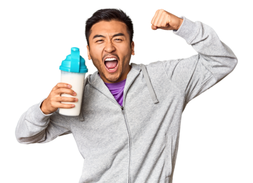 Fit Chinese male with protein shake and bottle in studio setup