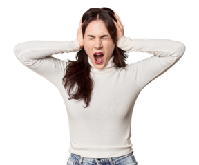 Young Caucasian woman in a studio setting covering ears with hands trying not to hear too loud sound.