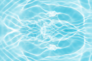 Bluewater waves on the surface ripples blurred. Defocus blurred transparent blue colored clear calm water surface texture with splash and bubbles. Water waves with shining pattern texture background.
