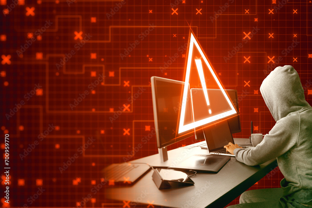 Leinwandbilder Side view of hacker using computers at desktop with creative red security alert on blurry background. Fraud and danger concept.