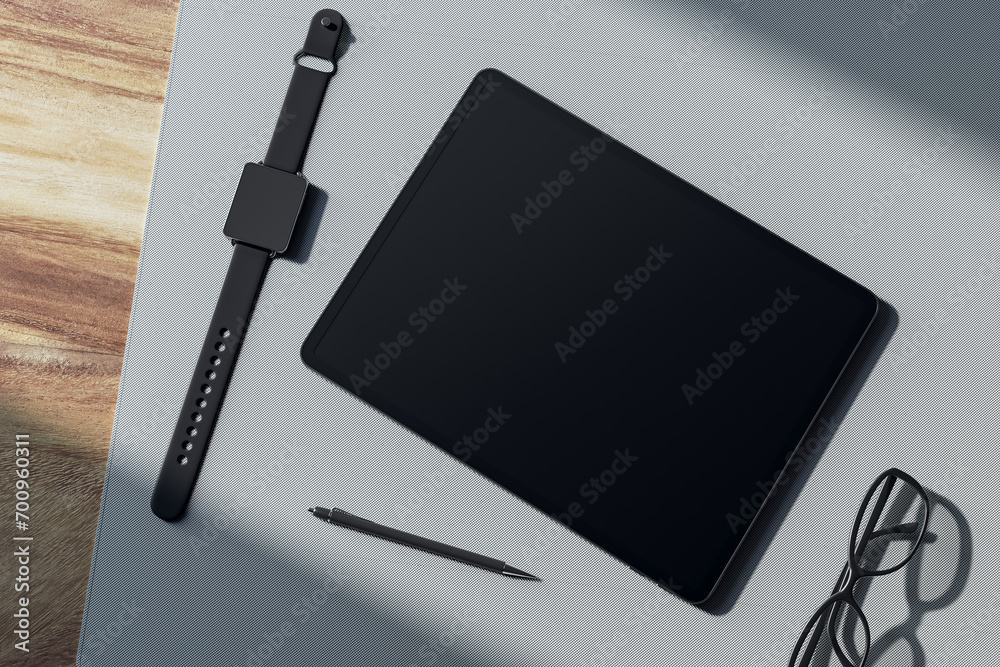 Poster top view of empty tablet screen, digital watch, pen and glasses on wooden tablet. devices at workpla