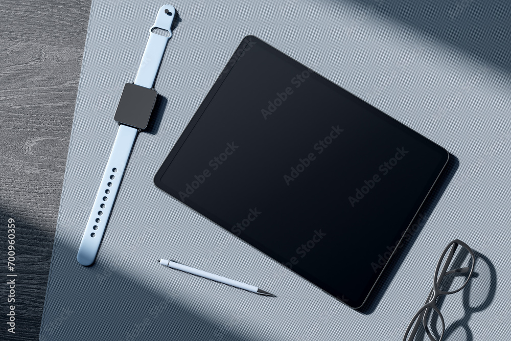 Poster top view of empty tablet screen, digital watch, pen and glasses on gray wooden tablet. devices at wo