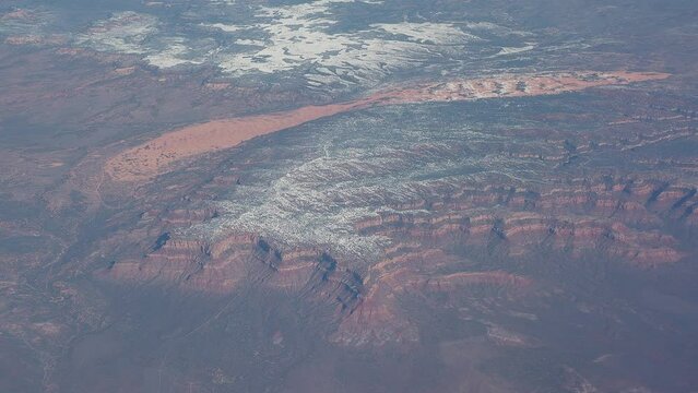 Flying over North America. Amazing  landscapes from the window of the airplane. Views of mountainous area