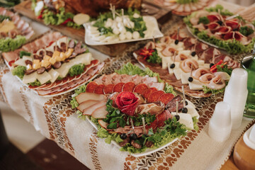Cossack table. Banquet hall Meat treats for guests. Homemade cutouts. Pork tenderloin. Delicious meat cuts. Meat plate. Delicious compositions from smoked mint. Cottage cheese.