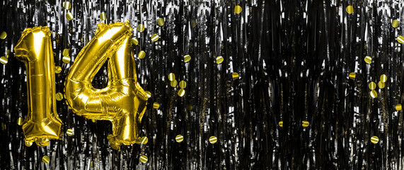 Gold foil balloon number number 14 on a background of black tinsel decoration. Birthday greeting card, inscription fourteen. Anniversary event. Banner.