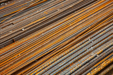 Rusty steel bars, essential for reinforcing concrete structures.