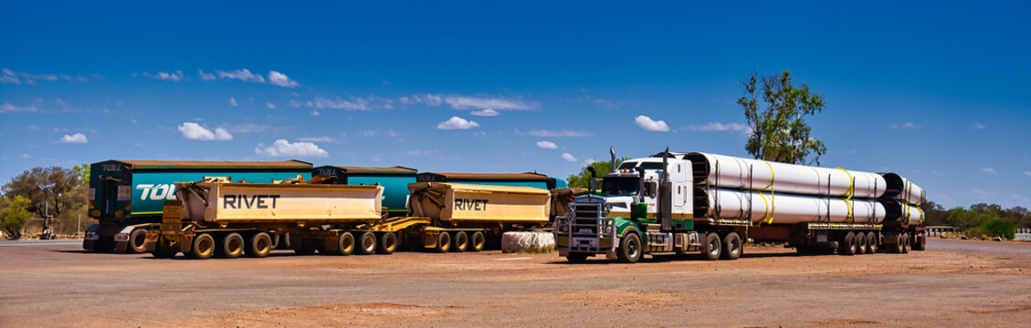 Panorama of road train trucks on a parking lot in the Australian outback. Newman, Nov. 19, 2023
