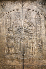 Basilica of the National Vow (Spanish: BasÃ­lica del Voto Nacional), Roman Catholic church located in the historic center of Quito, Ecuador. Door relief depicting a baptism