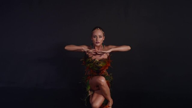 sexy woman dancing exotic dance in studio, moving her breasts, sexy and alluring lady, full-length