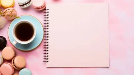 Fototapeten Coffee, macaron cake, blank notebook on pink table top view. Women's desktop. Cozy breakfast. © Артур Комис