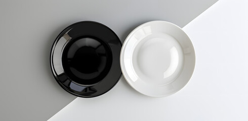 one black plate and one white plate